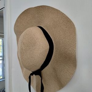 Straw hat with black ribbon